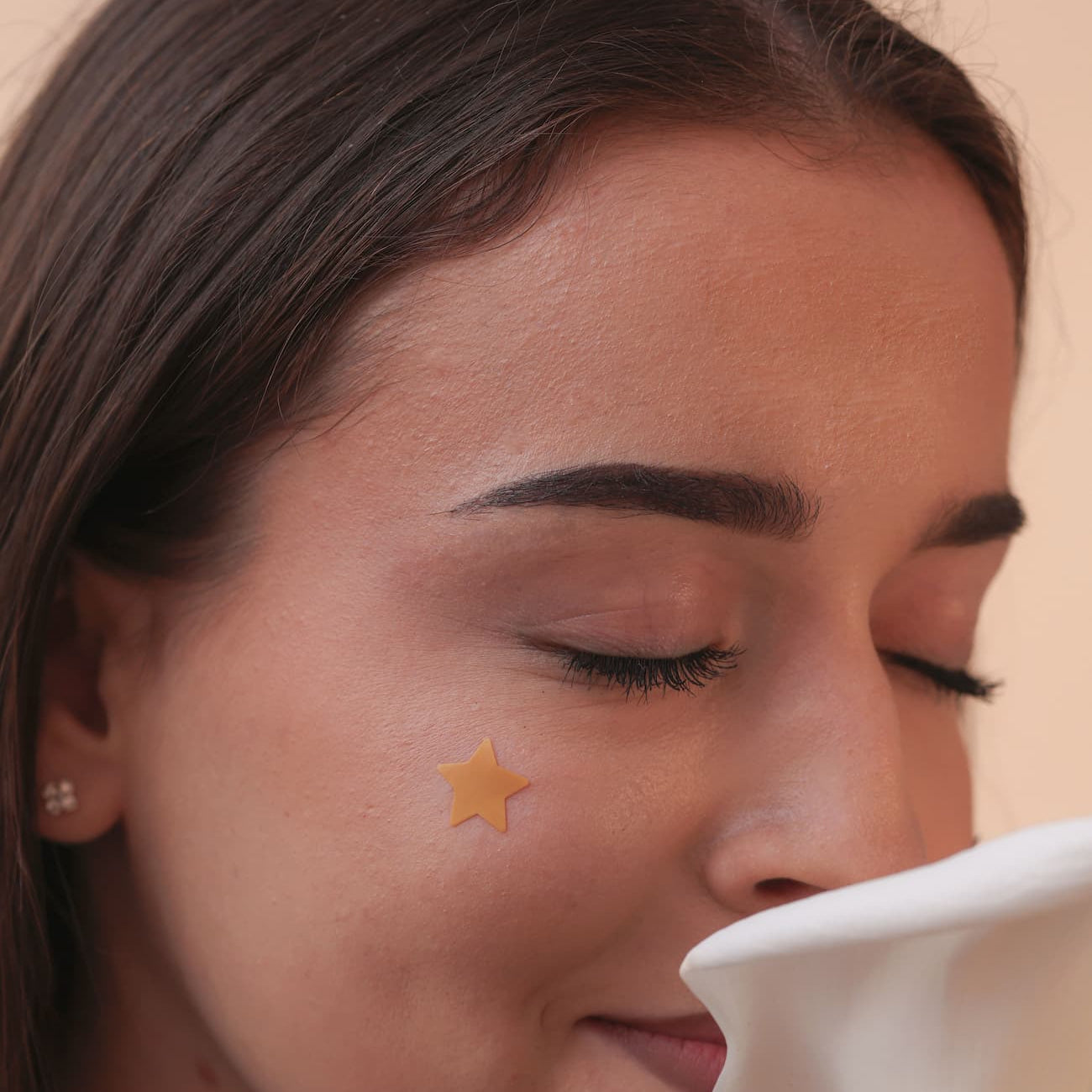 girl using acne patches in daily routine